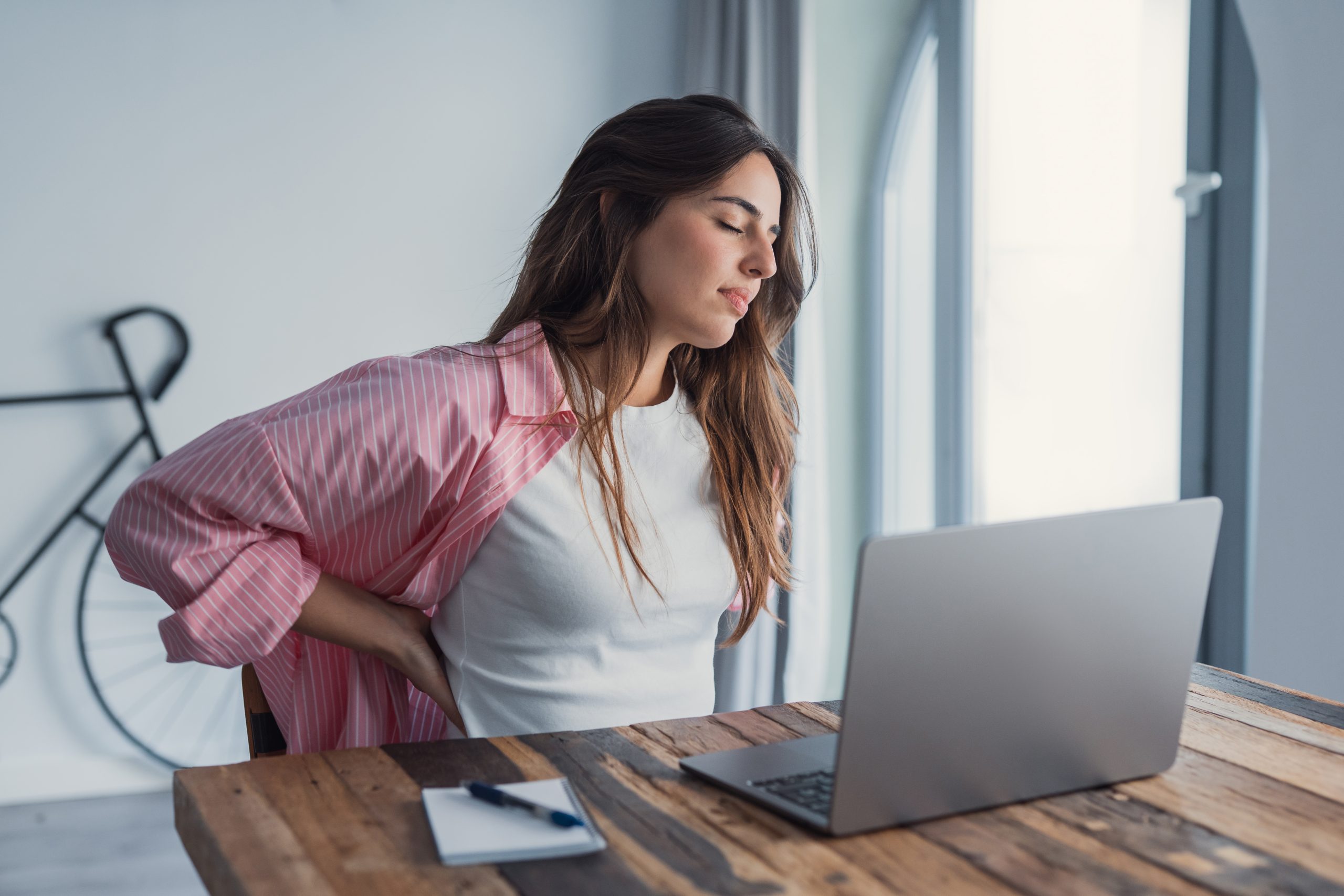 Tired and tense lady at work with anxiety and stress 